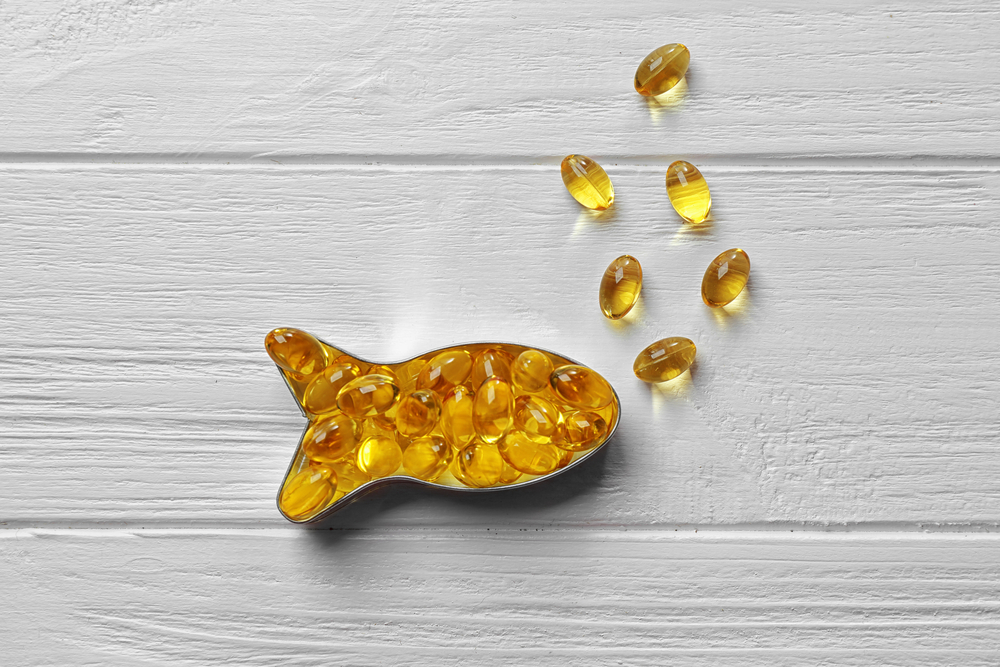 Omega 3 fish oil capsules in the shape of a fish